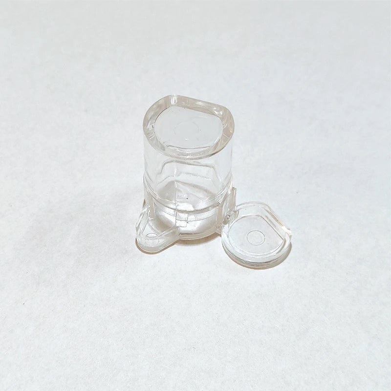 Two feeding trays and brush included in DIY ant farm accessories set