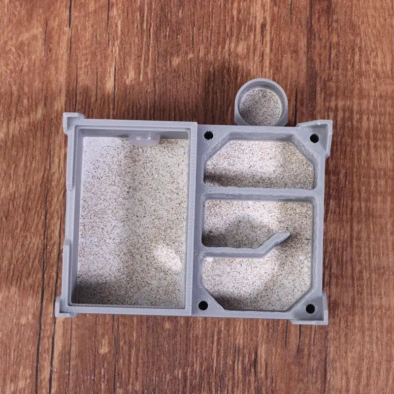 Quartet ant farm placed next to a test tube setup showing compact desk footprint