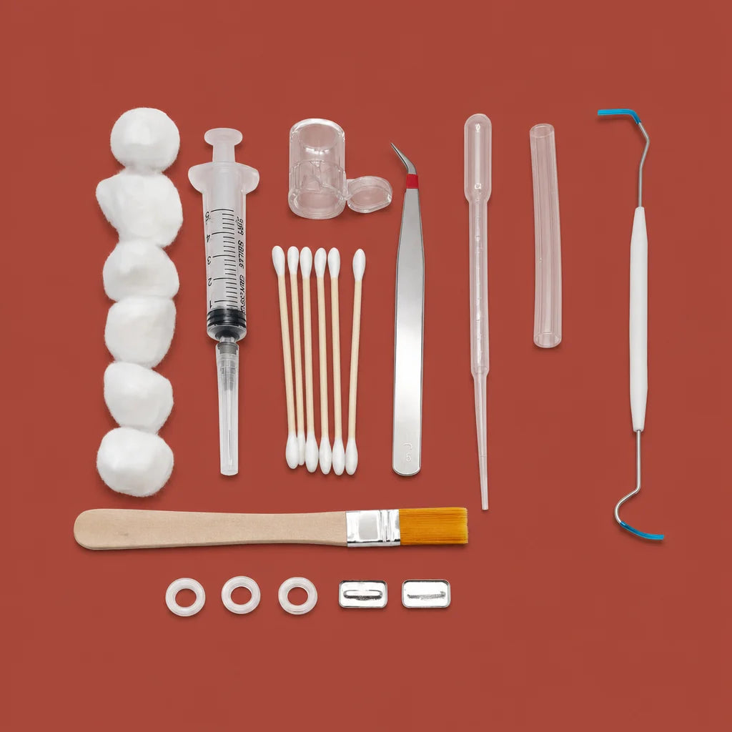 11-piece ant farm toolkit with syringe, tweezers, and feeding trays on white background